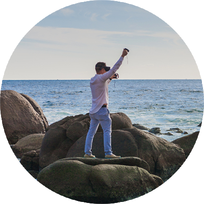 Ivan Guaderrama standing on the rocks of Los Cabos, Mexico — contemporary Christian artist and creator of Reality Painting
