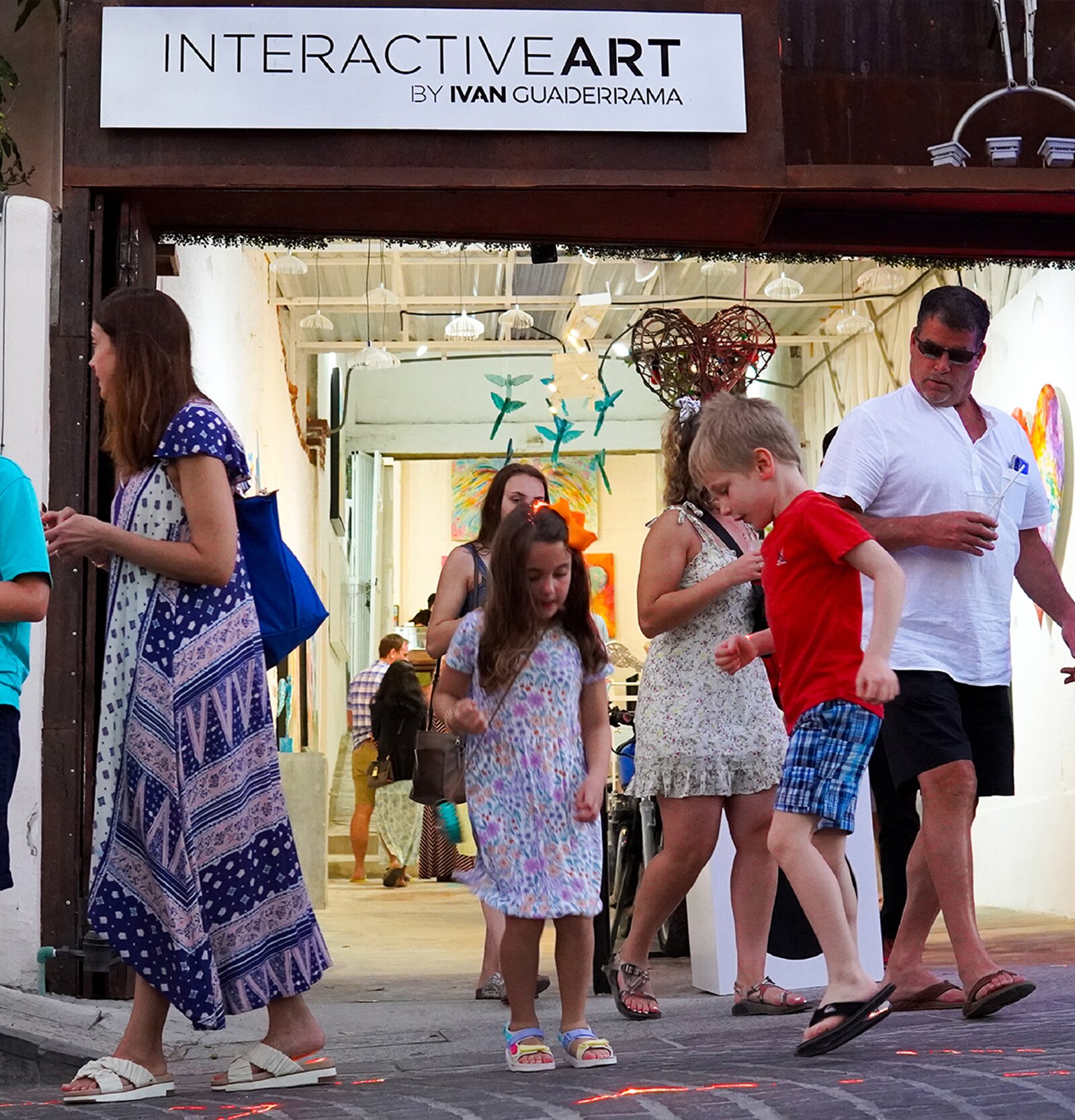 Interactive Art by Ivan Guaderrama gallery storefront with visitors during Art Walk in San José del Cabo Mexico